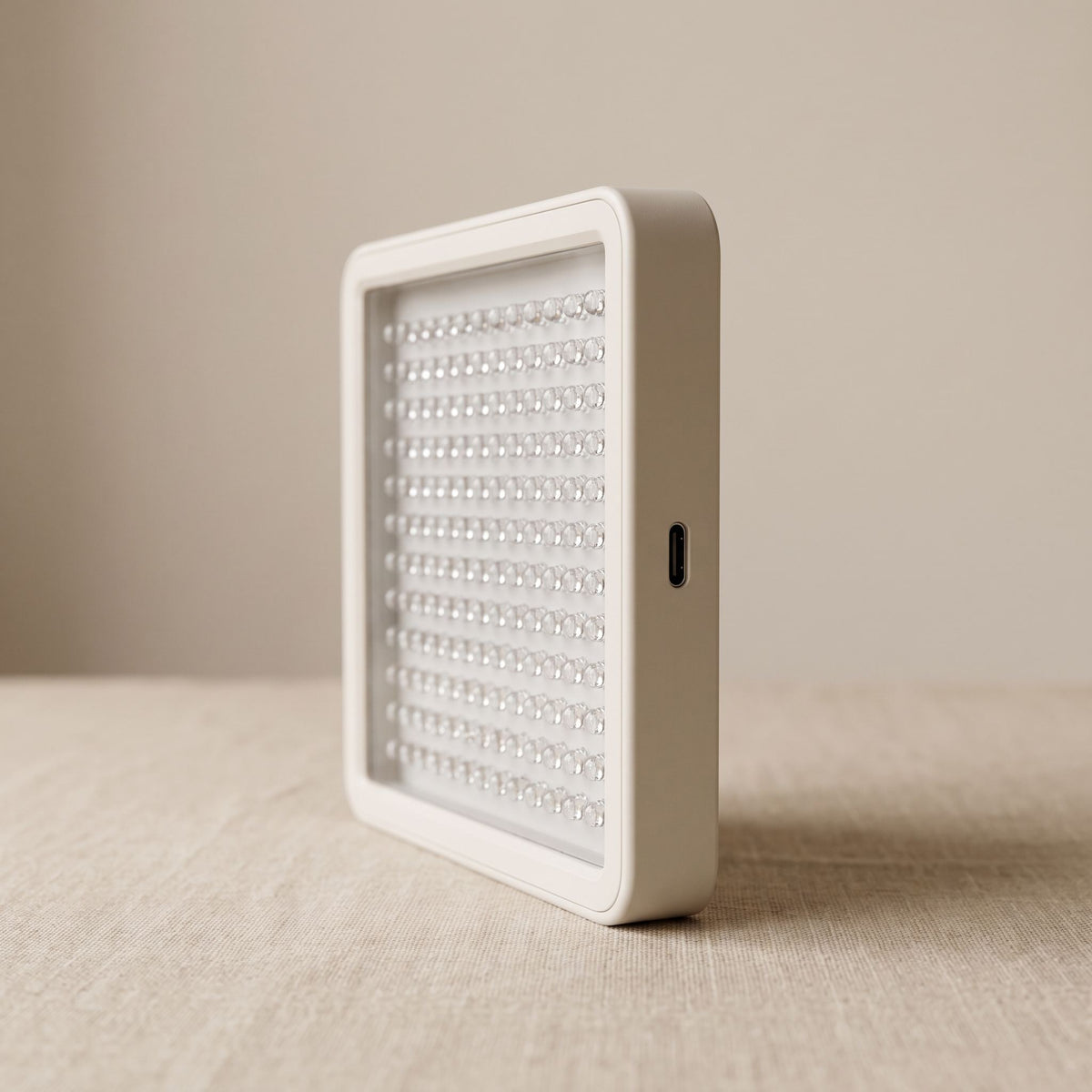 Folliq Portable Face Panel side profile with the USB-C port