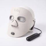 Folliq Red Light Therapy Face Mask in ivory with its controller and cable, on white