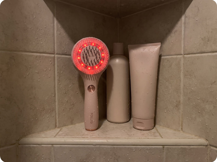 The massager on her shower shelf, light on