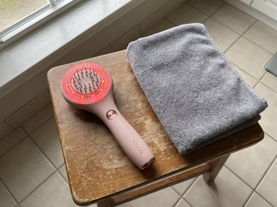 The massager on a wooden bathroom stool